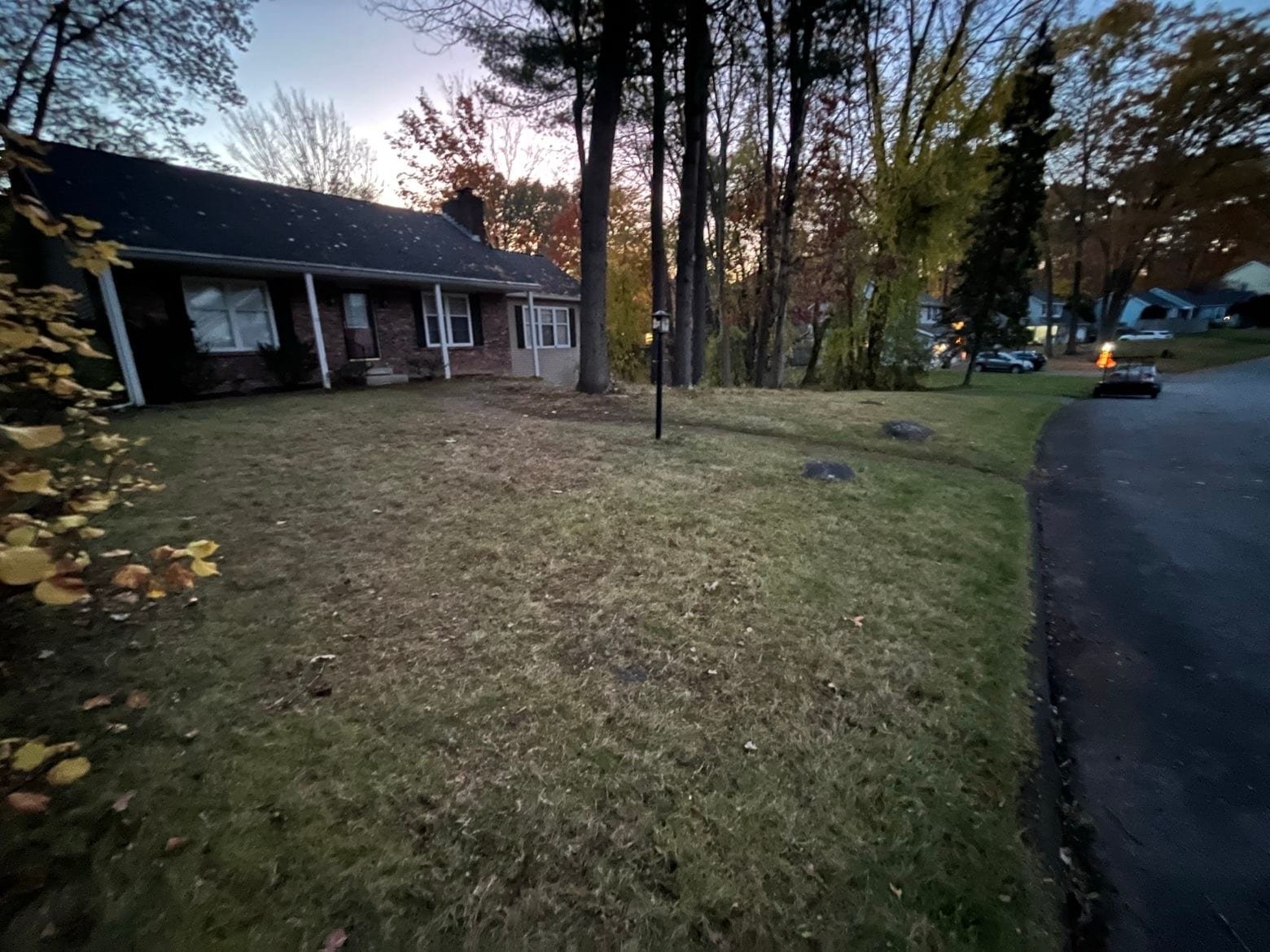 Same brick ranch front yard cleared clean by dusk